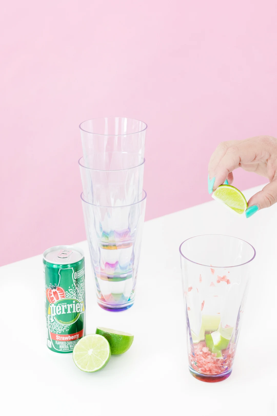 squeezing lime into cup