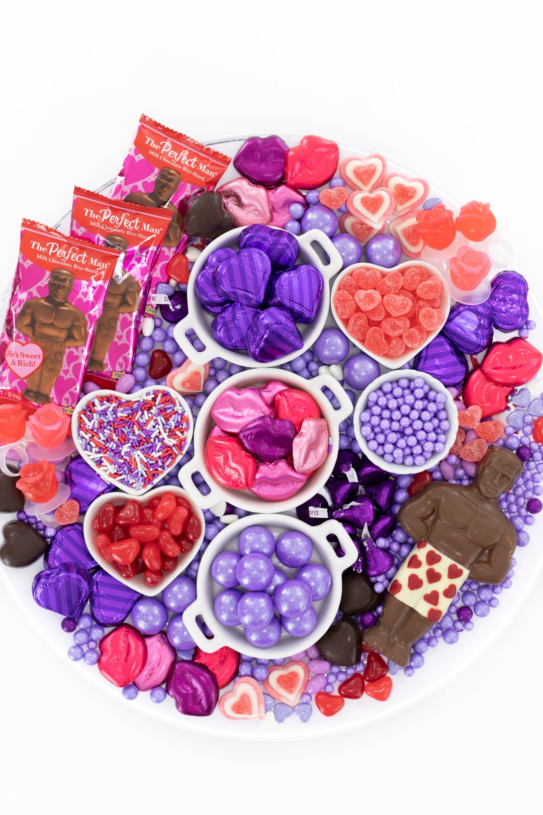 Galentine's Day Themed Candy Charcuterie Board loaded with red and purple candies.