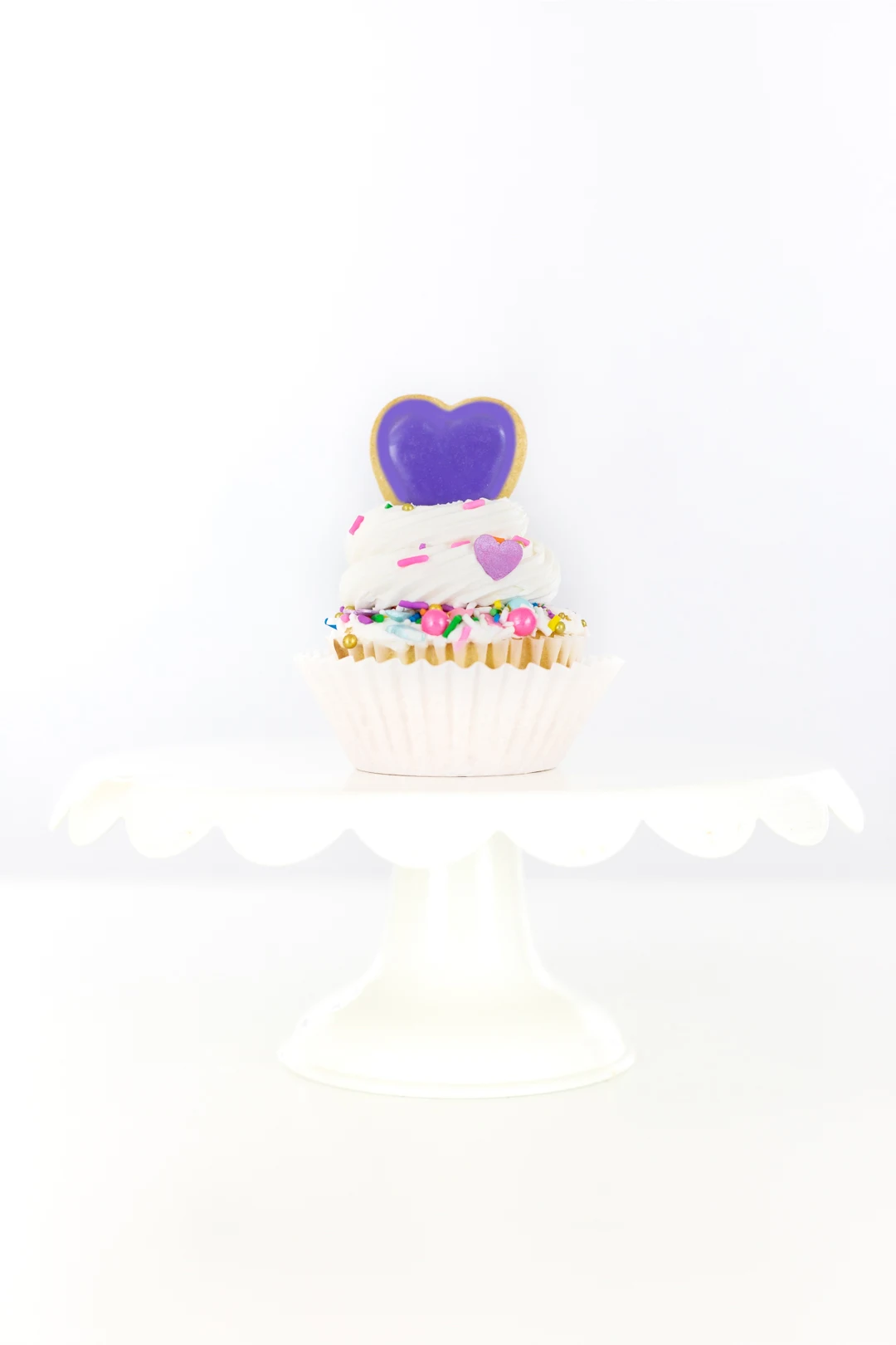purple heart on top of cupcake