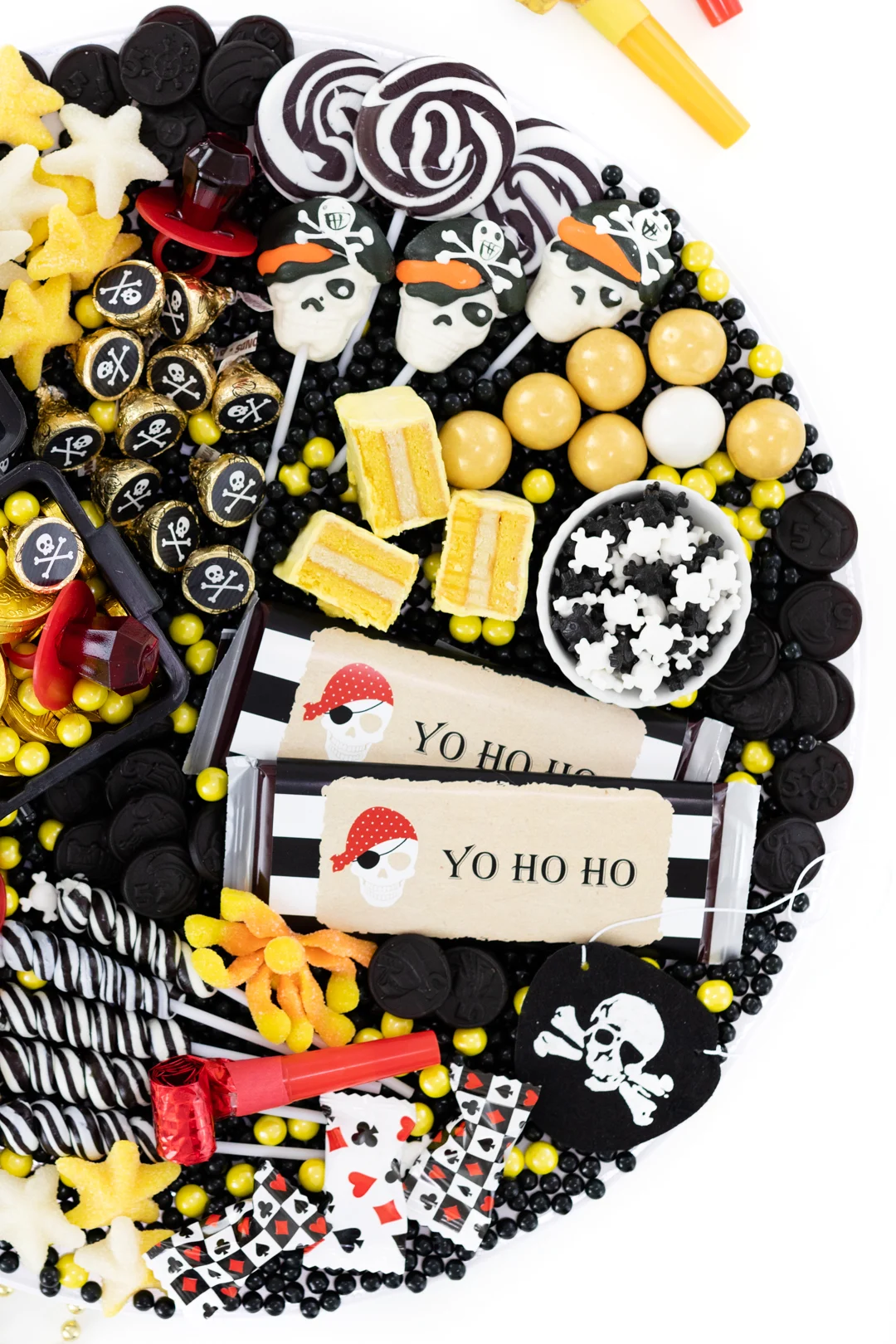 pirate party platter with skeleton lollipops and gold candy.