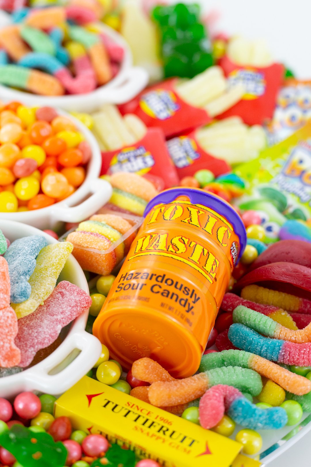 Toxic Waste Candy Barrel sitting on a load of other April Fools Candy.