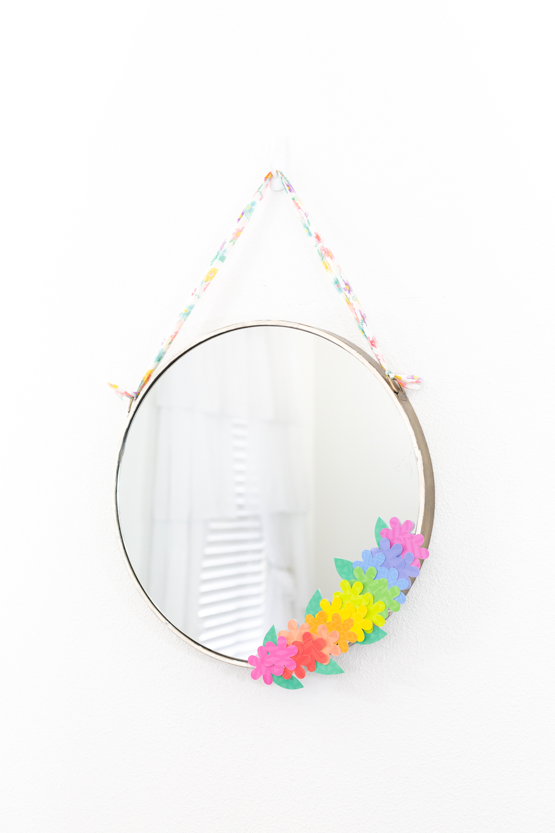 beautiful round mirror with paper flower decoration