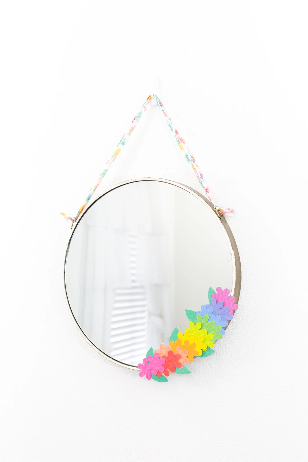 beautiful round mirror with paper flower decoration