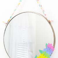 round mirror craft with rainbow faux flowers