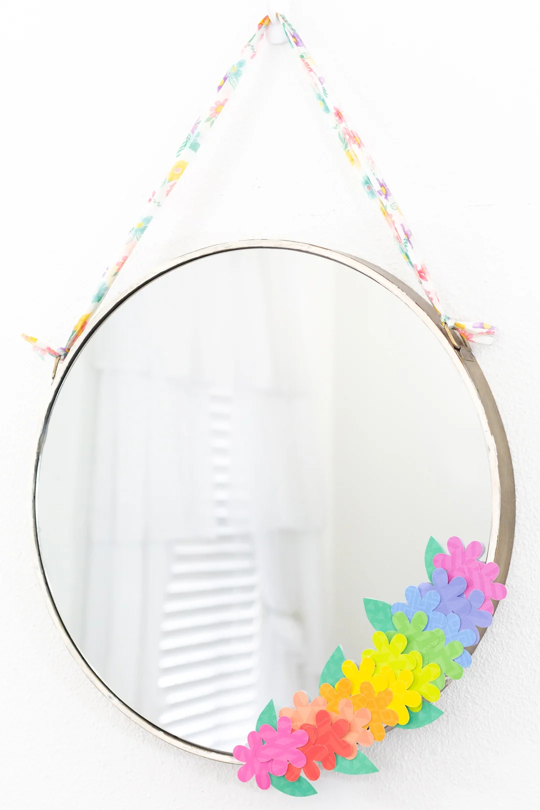 round mirror craft with rainbow faux flowers