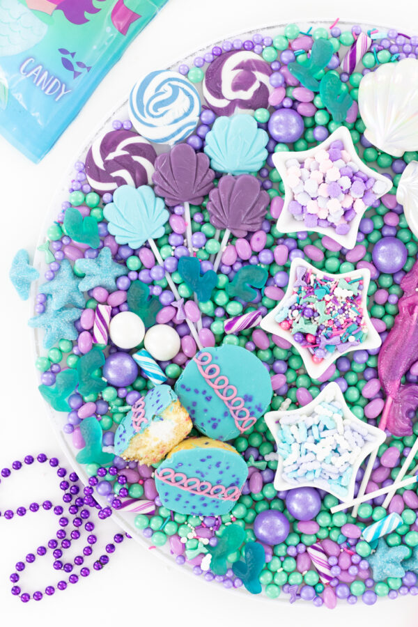 pretty dessert tray with mermaid themed candies.