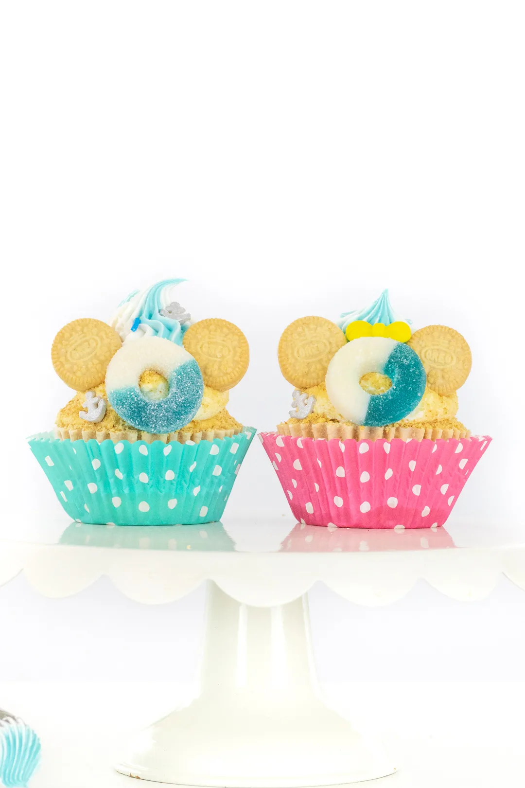 minnie and mickey cupcakes that are inspired by a disney cruise with graham cracker crumbs for sand