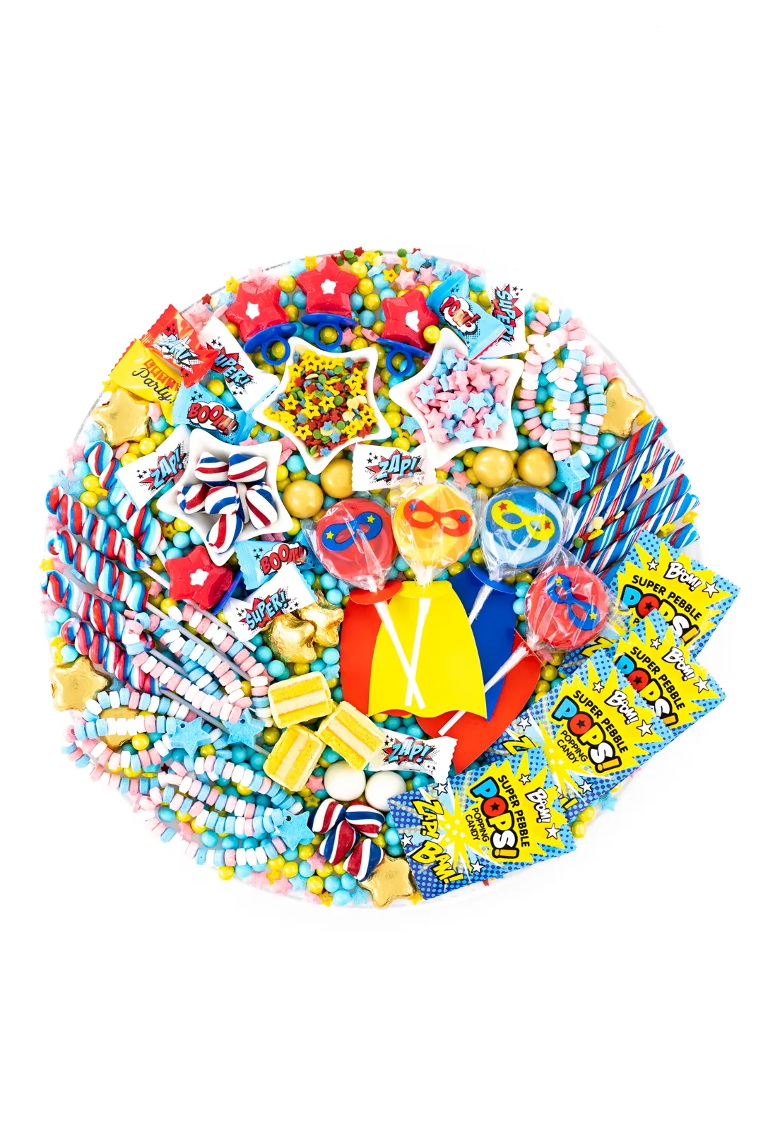 superhero candy charcuterie board with yellow, red, white and blue candy