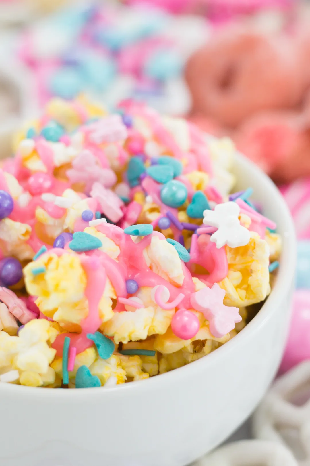 pastel popcorn with pink icing and sprinkles
