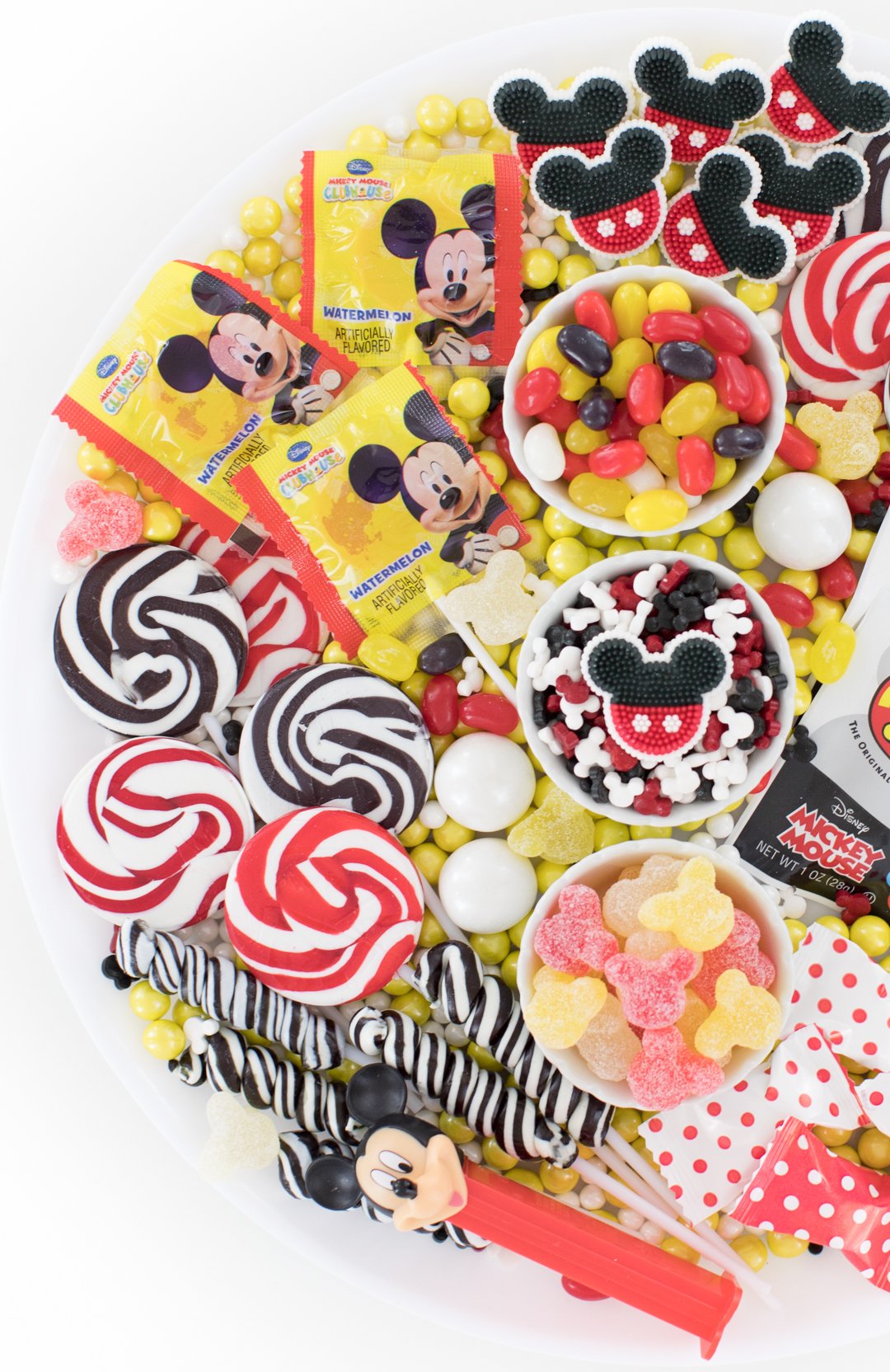 disney mickey mouse party platter filled with mickey candies and lollipops