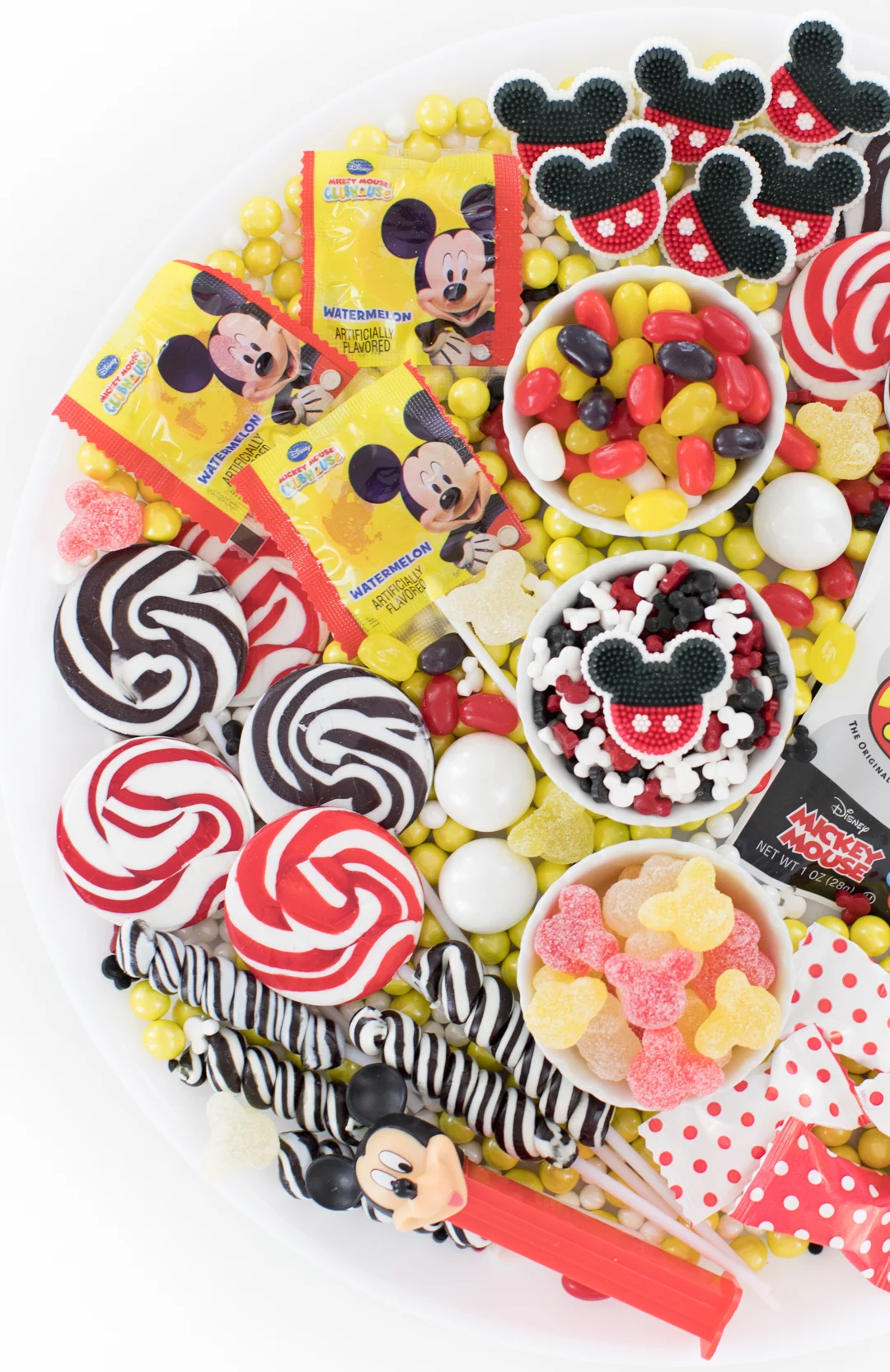 disney mickey mouse party platter filled with mickey candies and lollipops