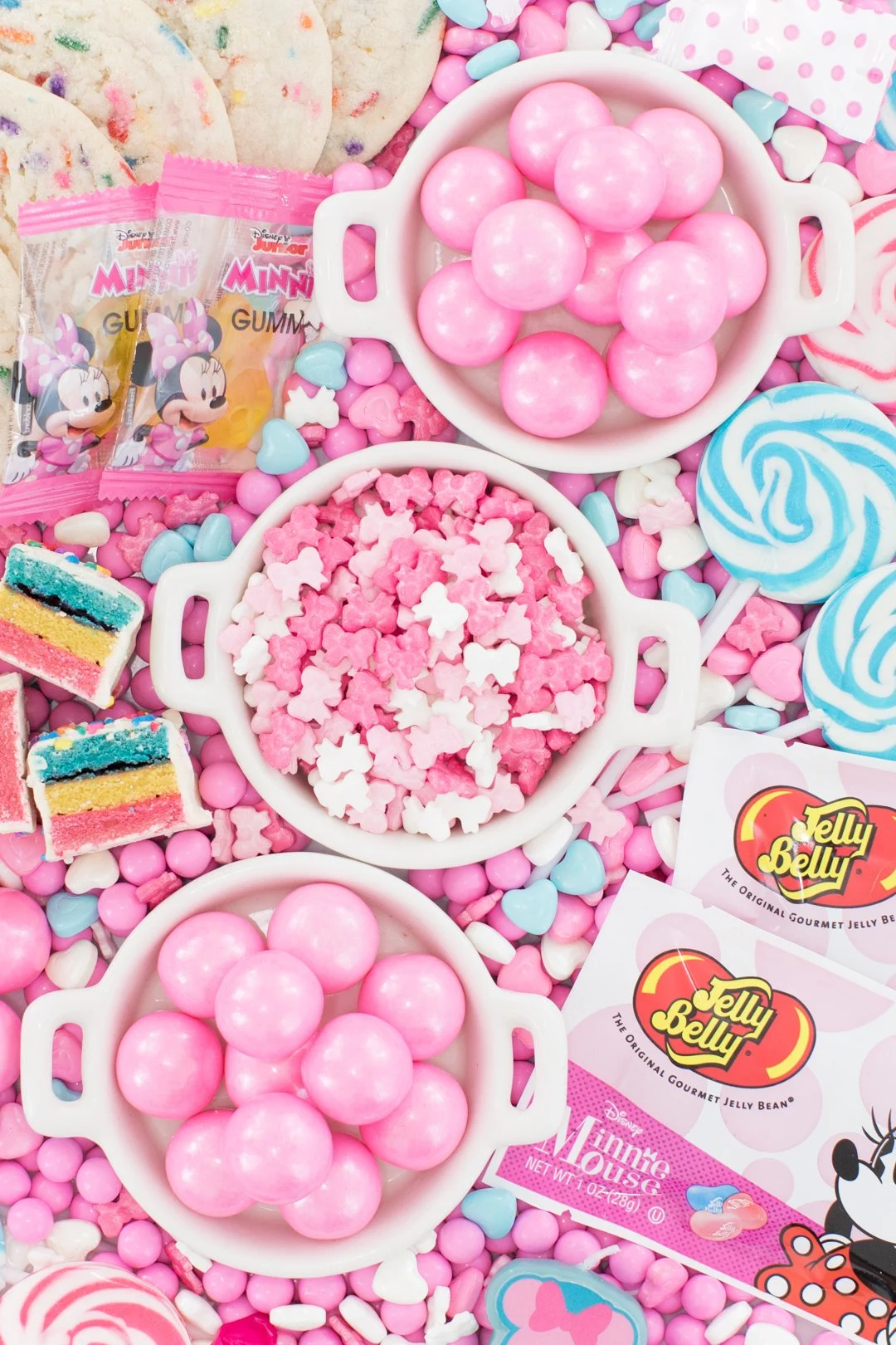 pretty pink candies in small dishes on top of a larger candy platter