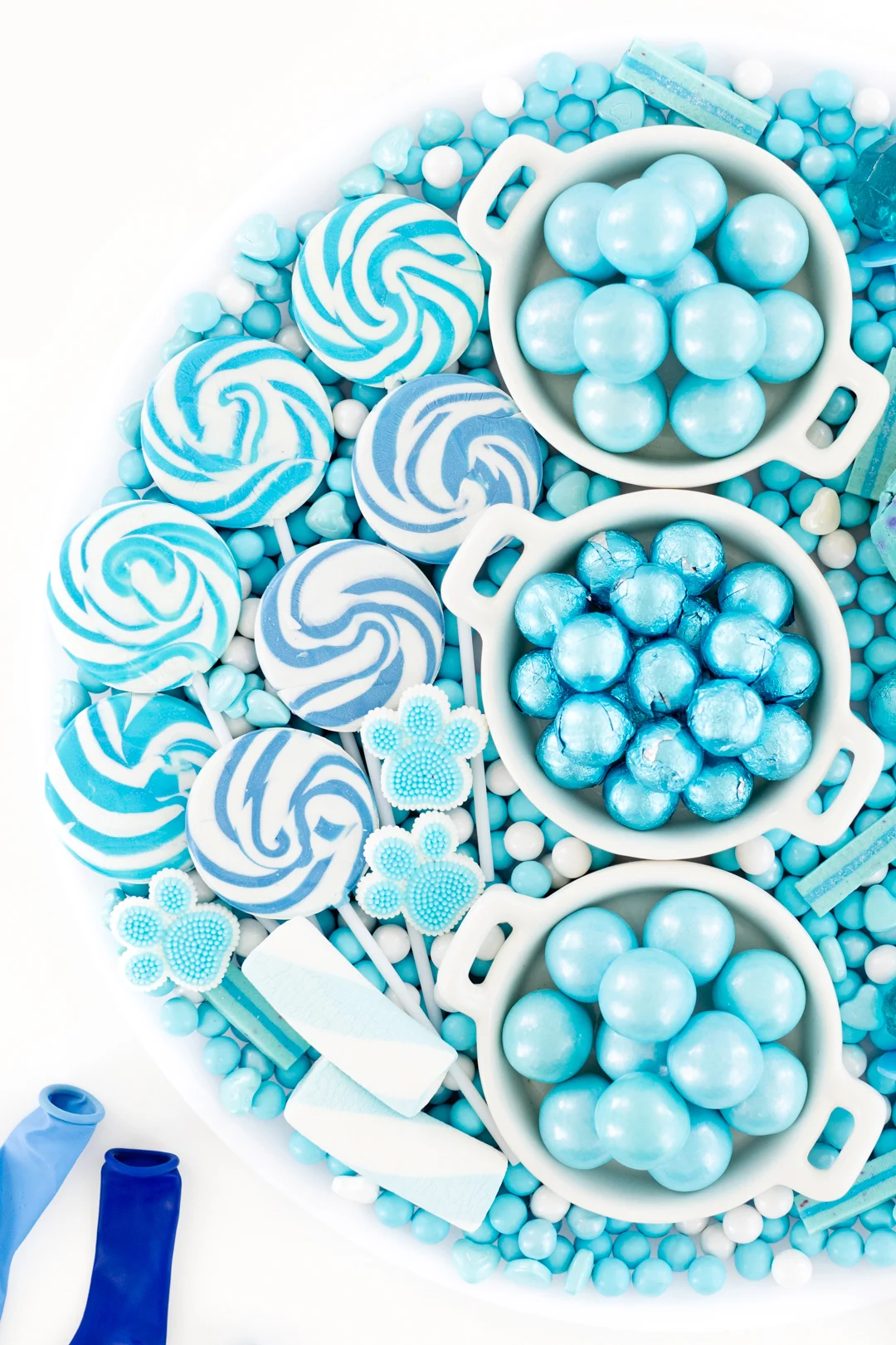 candy board with swirl lollipops in various shades of blue
