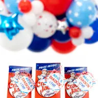 cracker jack boxes lines up with a 4th of july gift tag tied onto them
