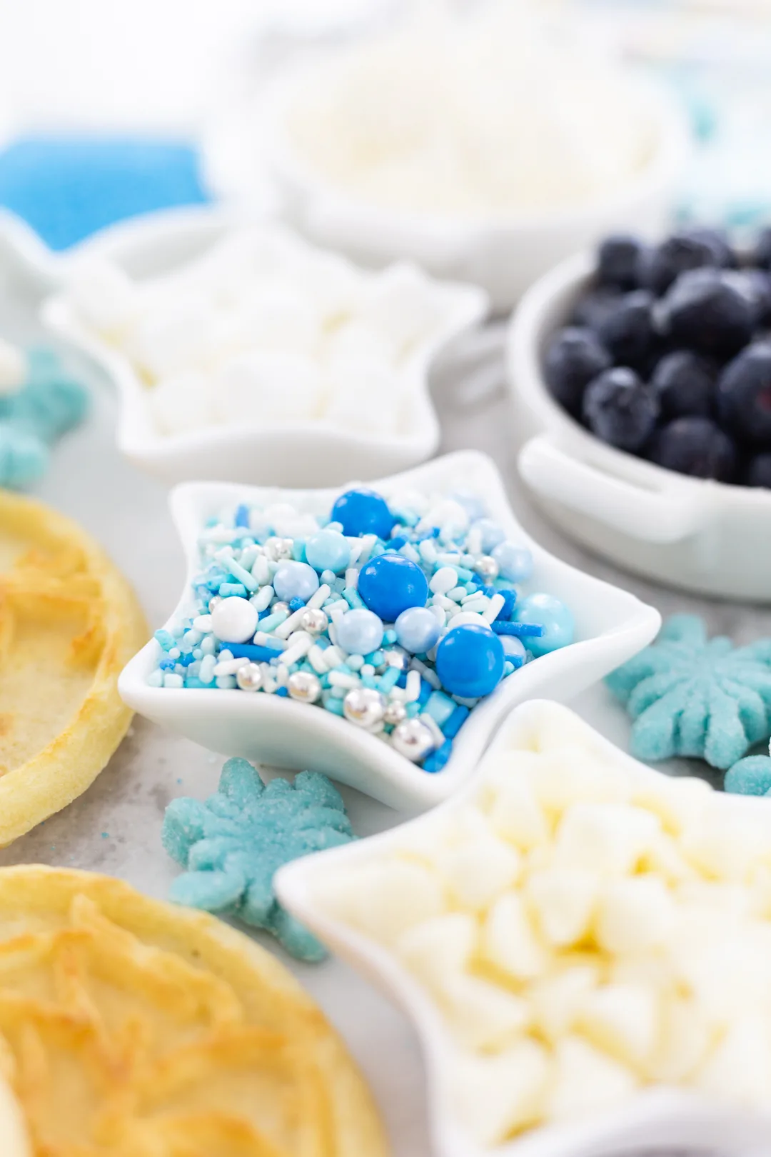 pretty frozen movie or cinderella inspired sprinkle mix with shades of blue, white and silver