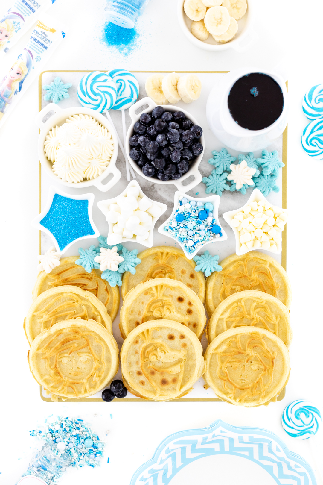 Waffle Board with fun matching sprinkles, fruits and blue syrup.