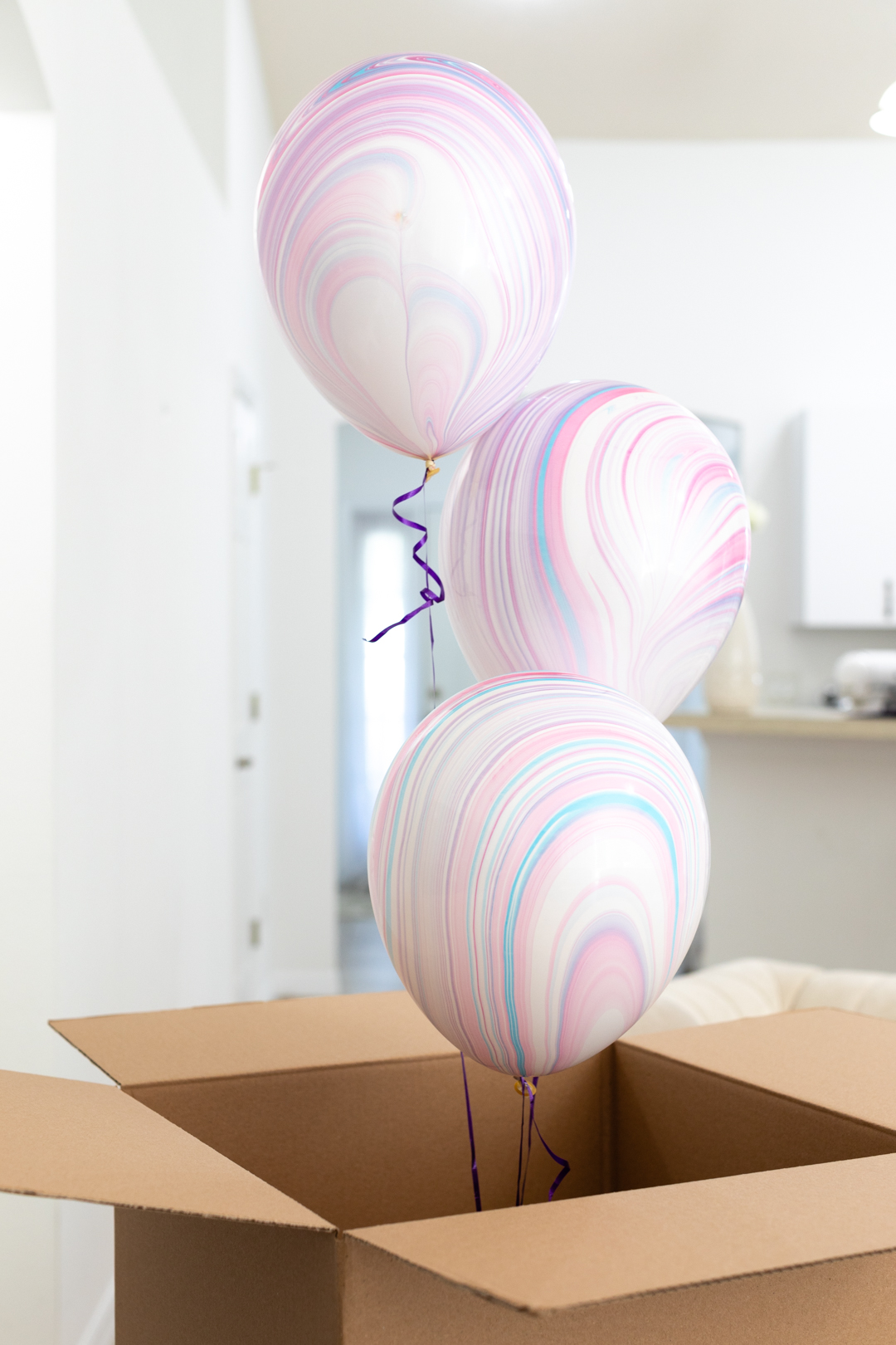 balloons coming out of a box