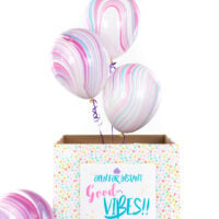balloons popping out of a box surprise