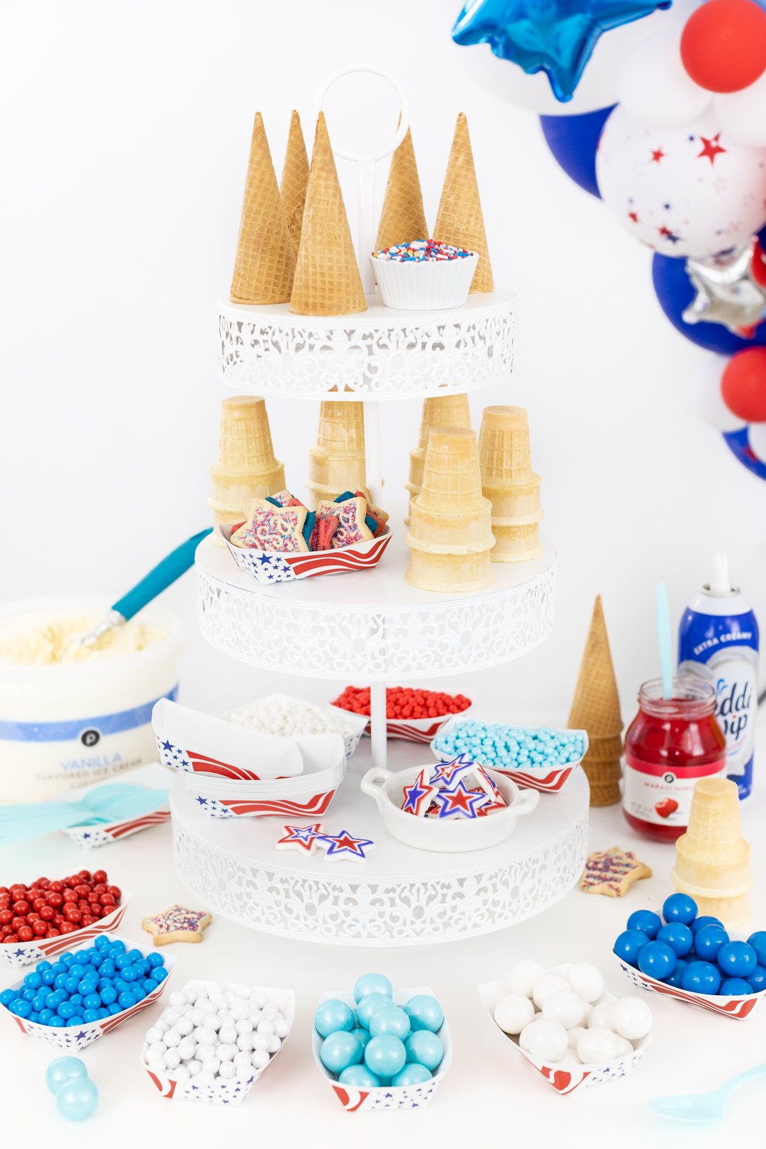 3-tiered ice cream buffet with patriotic inspired toppings