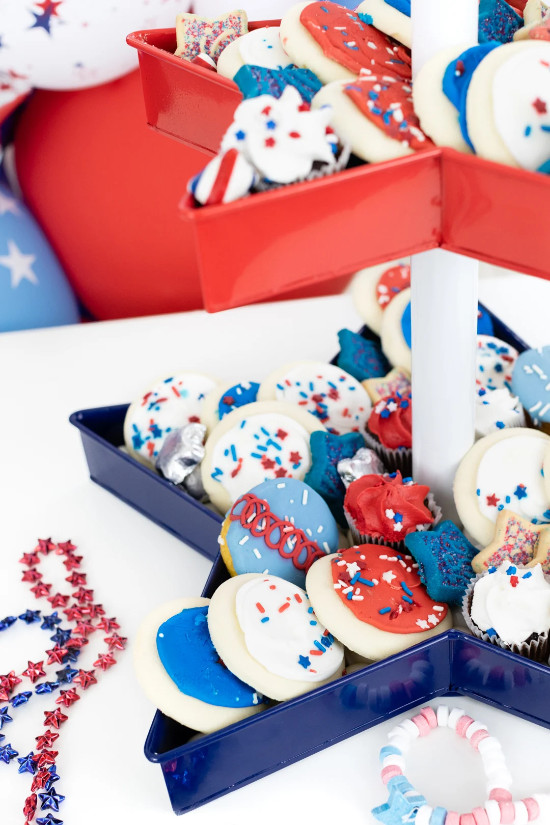 up close of red white and blue desserts. Cookies, cupcakes and candy.