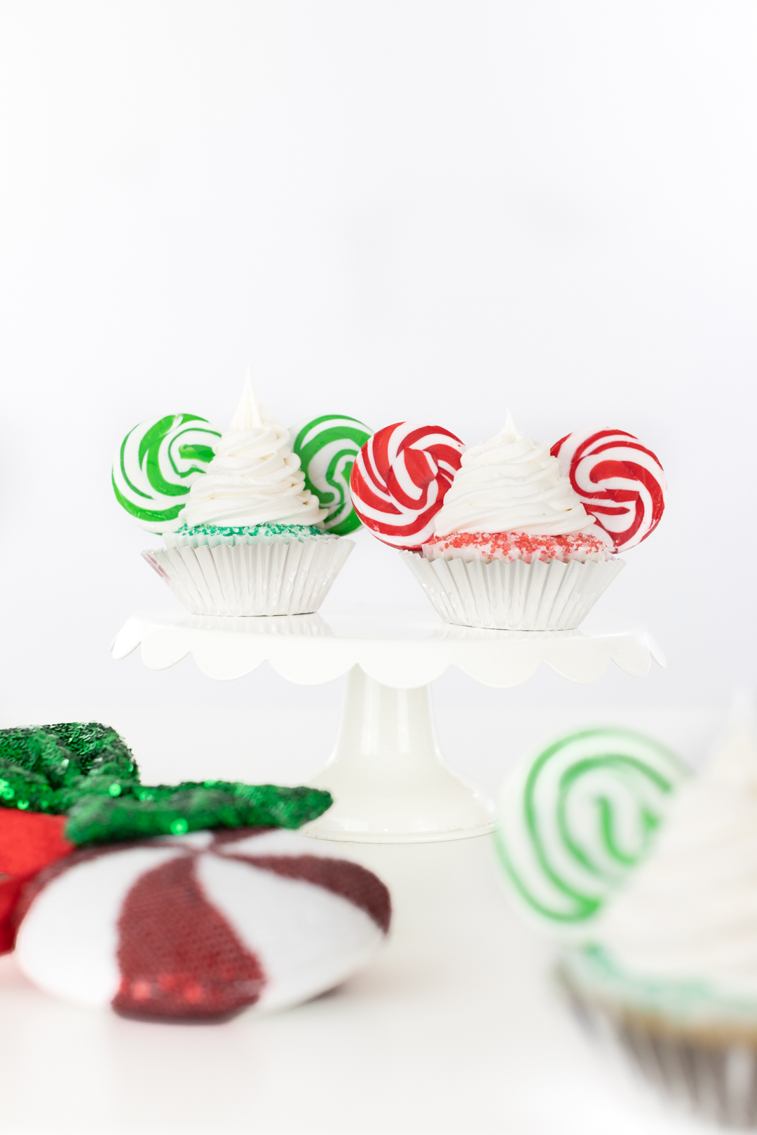 very merry disney christmas cupcakes with red and green swirl mickey ears