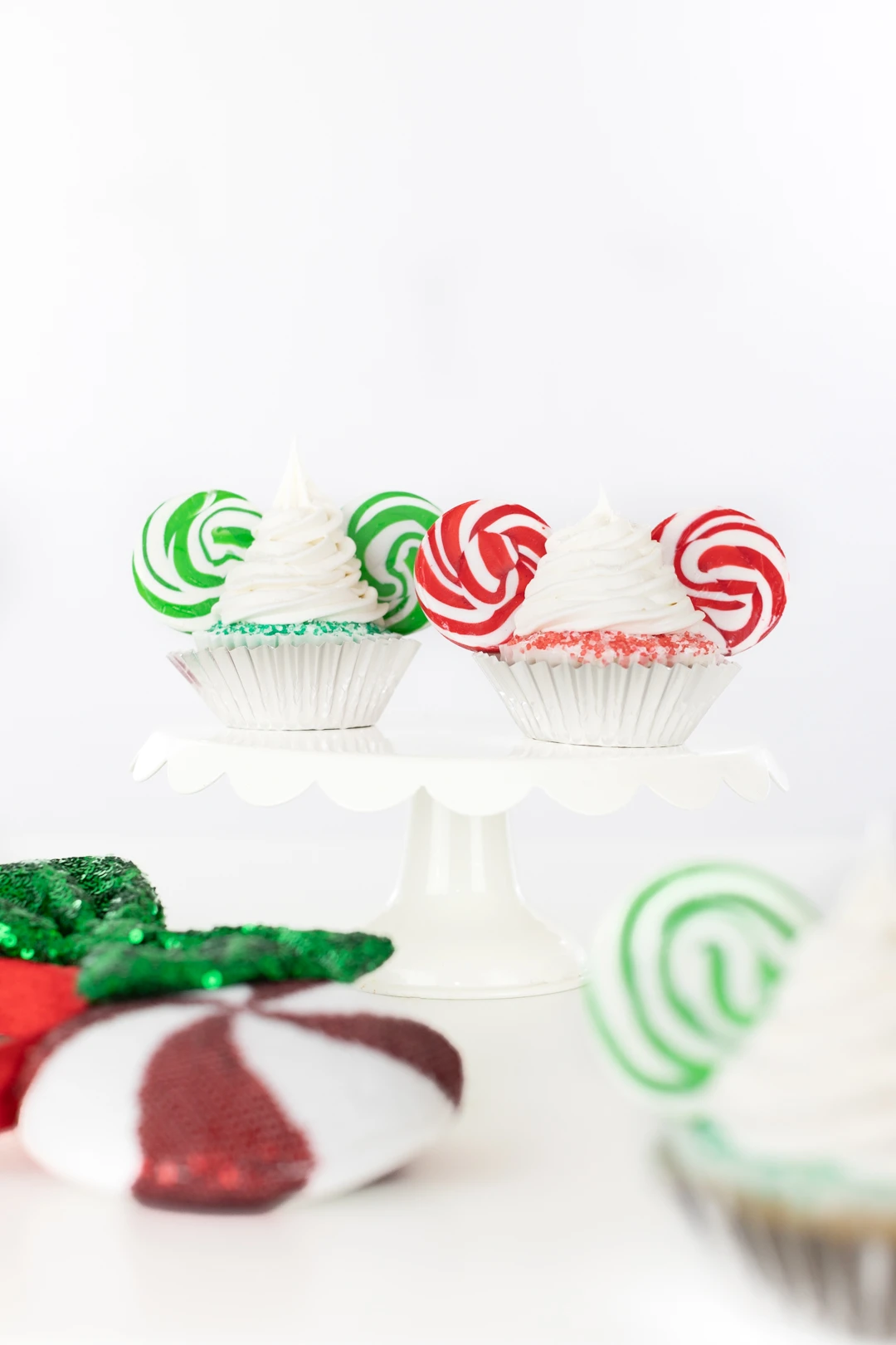 very merry disney christmas cupcakes with red and green swirl mickey ears