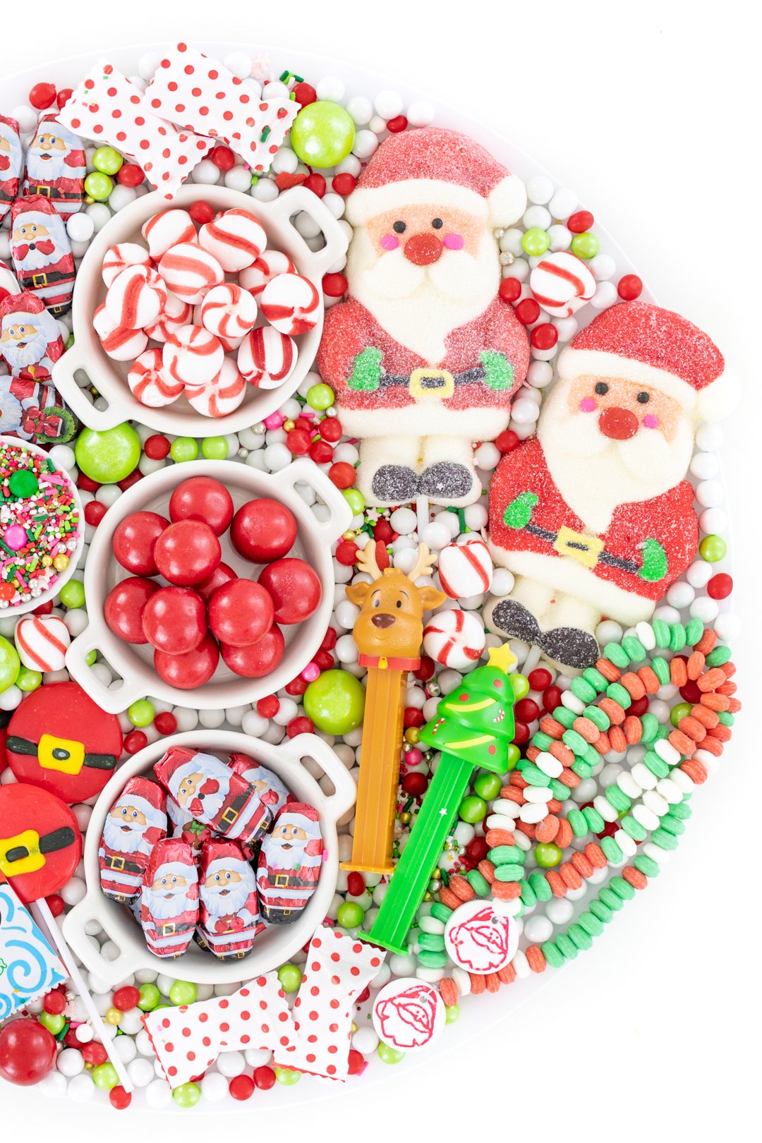 christmas candy board with a heavy lean towards santa candies. chocolates, gumballs, pez dispensers