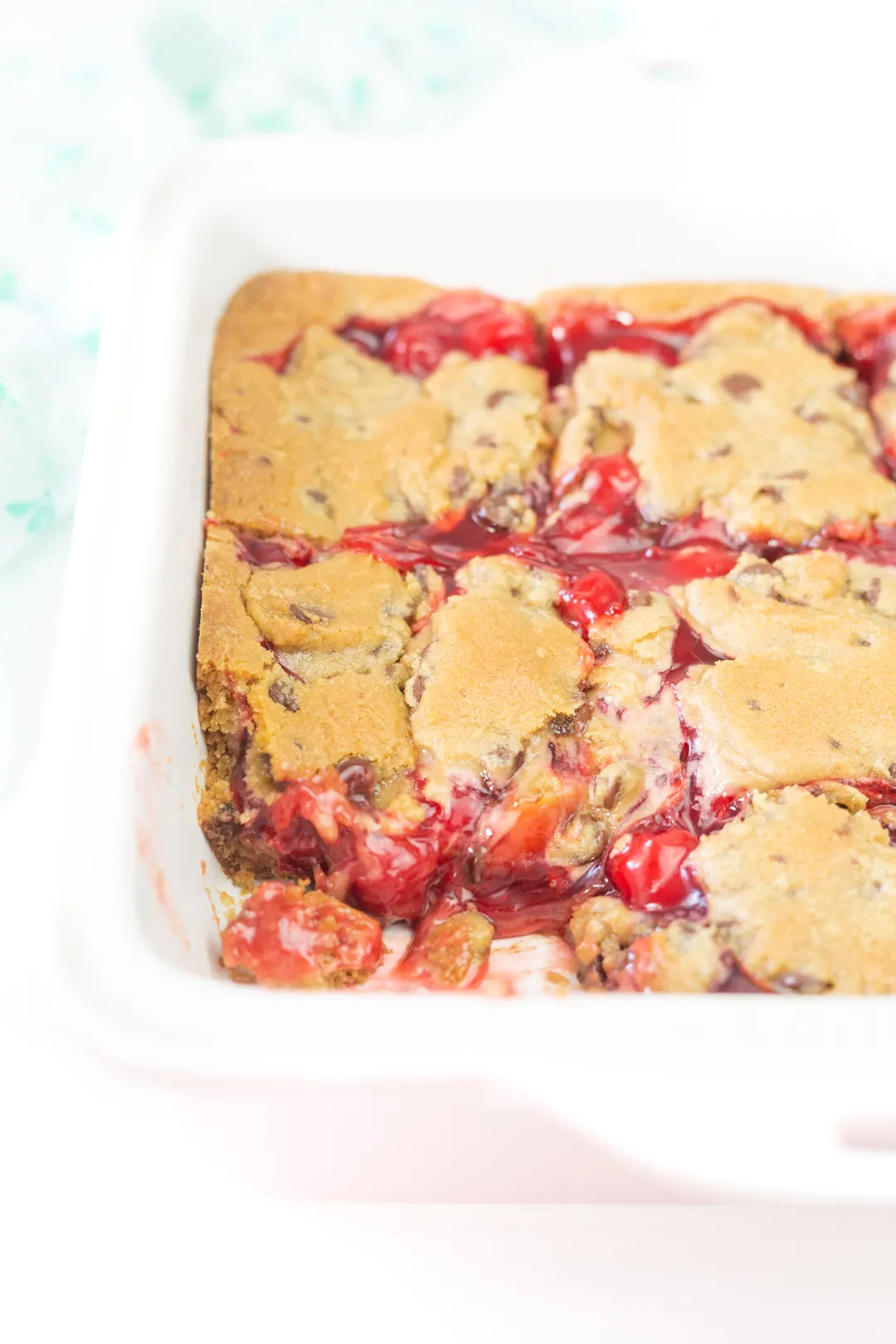 chocolate chip cherry bars up close with oozy cherry filling