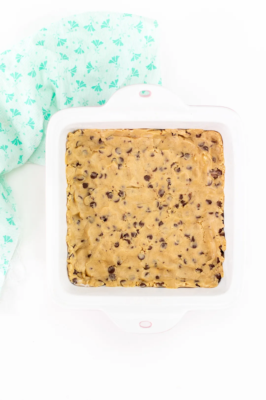 chocolate chip cookie dough pressed into baking dish