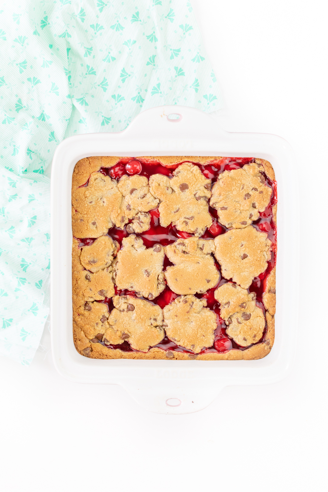 cherry pie chocolate chip cookie bars fresh from the oven.