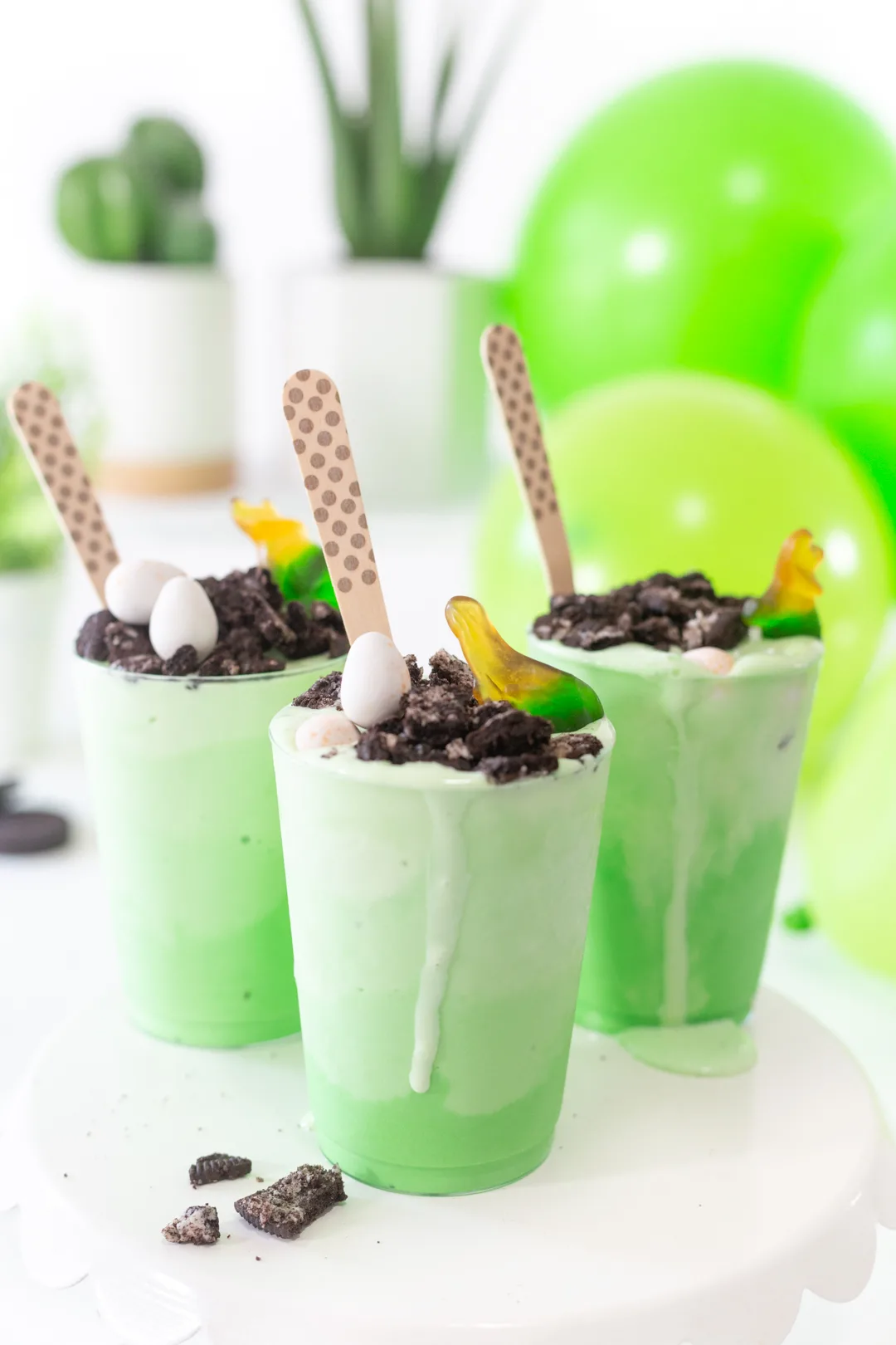 Dino sundaes up close. Pretty green layers of ice cream topped with crushed OREO cookies