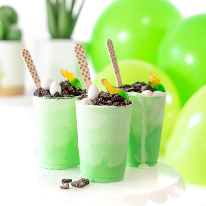 Fun Dino Ice Cream Sundaes with Layered Green Vanilla Ice Cream and fun toppings.