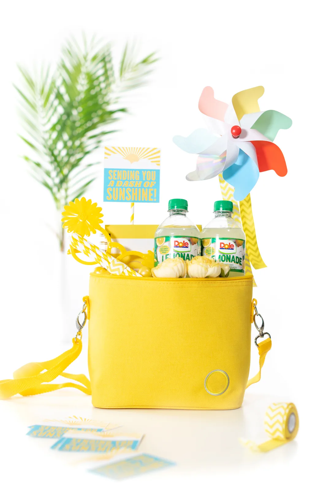 sunshine gift basket mini cooler with cold drinks and other yellow trinkets. Sunshine Gift Tag.