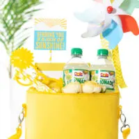diy gift basket that is yellow themed. All gift trinkets are placed into a yellow mini cooler to deliver 