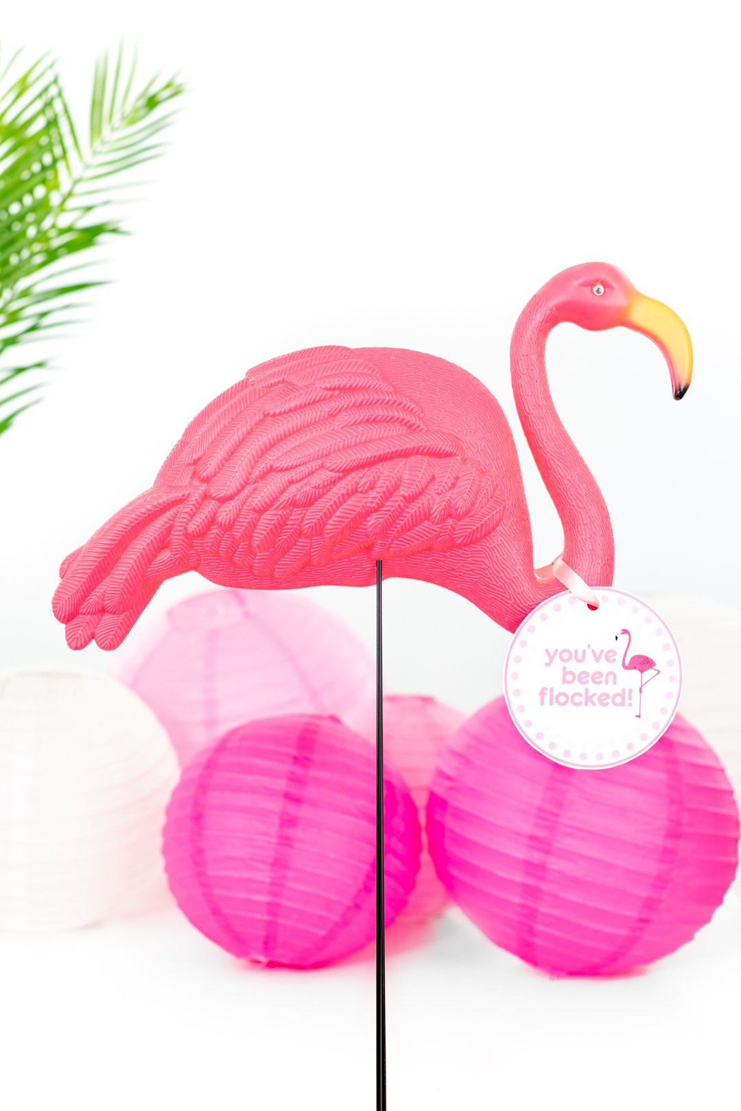 plastic yard flamingo in a party scene with paper lantern decorations
