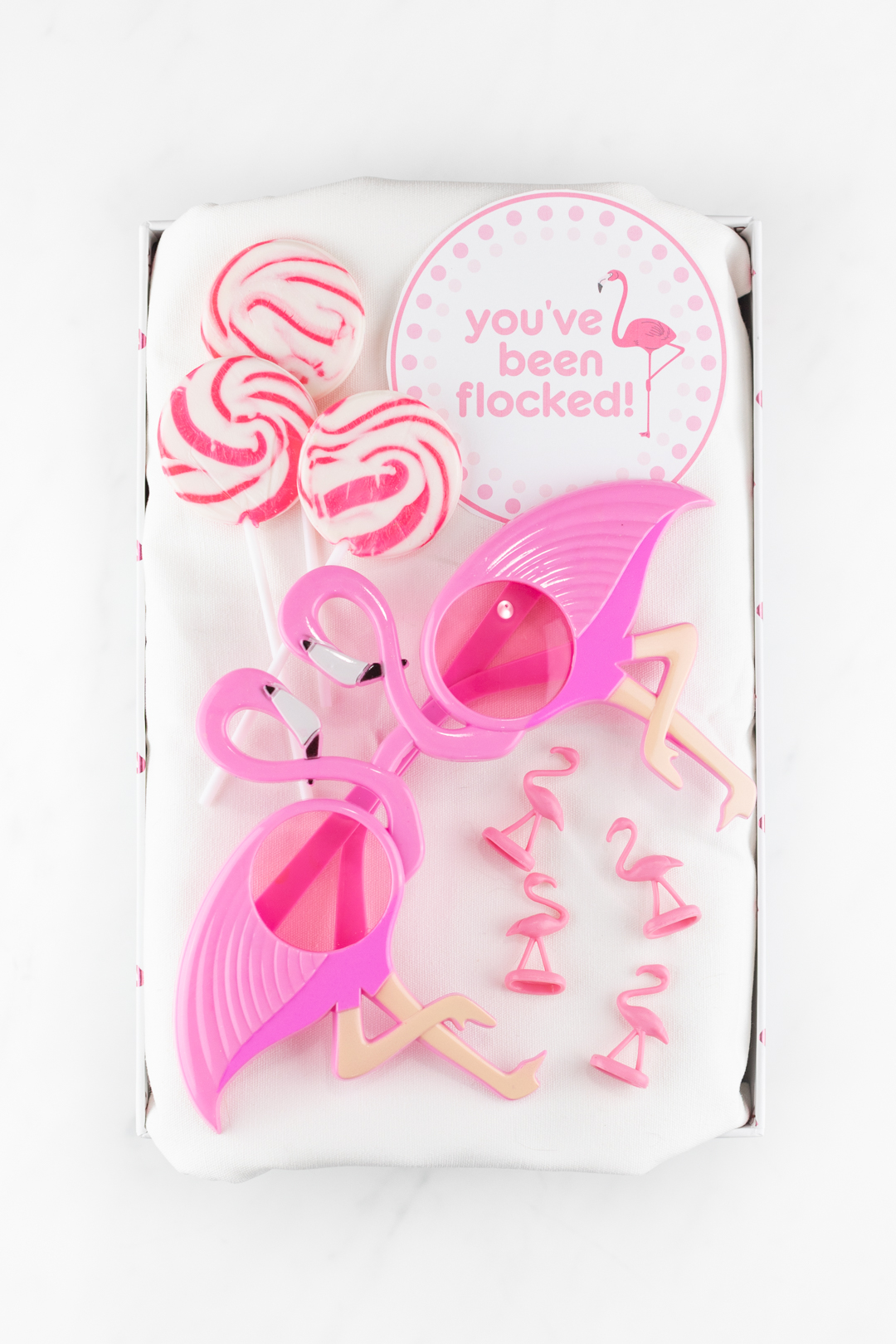 you've been flocked gift box with flamingo glasses, lollipops, mini flamingo figurines