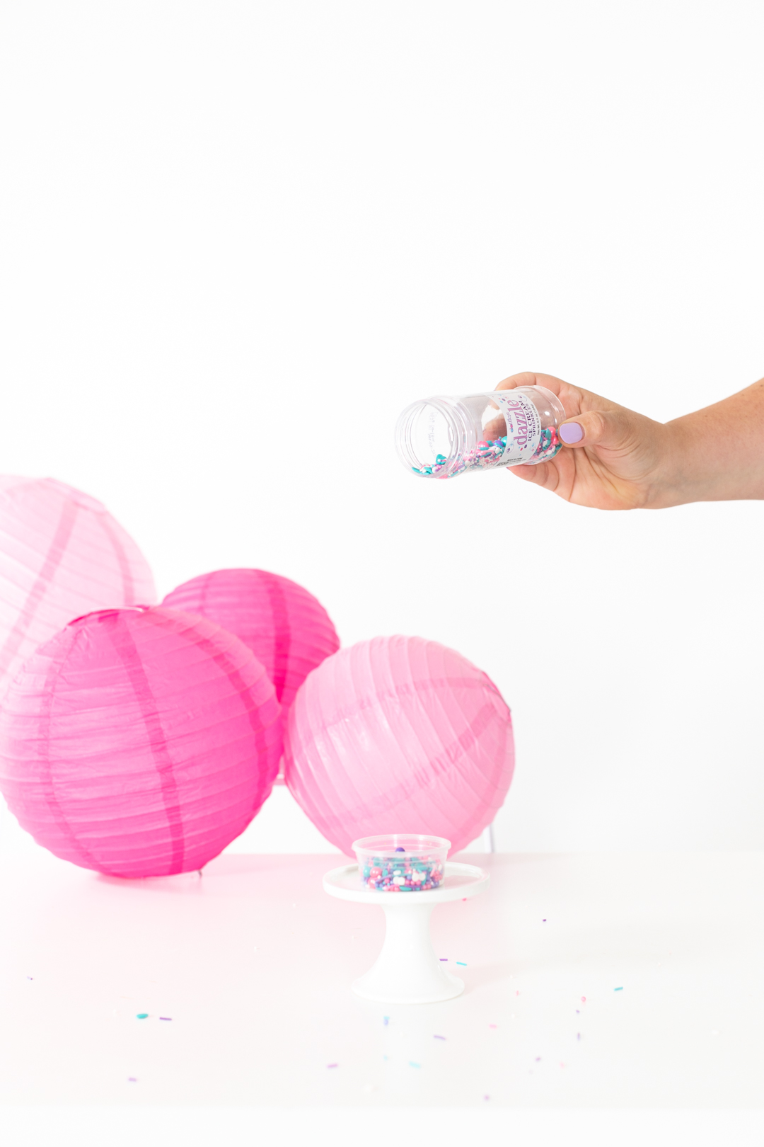 adding sprinkles to tiny plastic containers