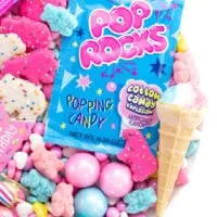 candy platter with pop rocks and gumballs and other small candies and cookies