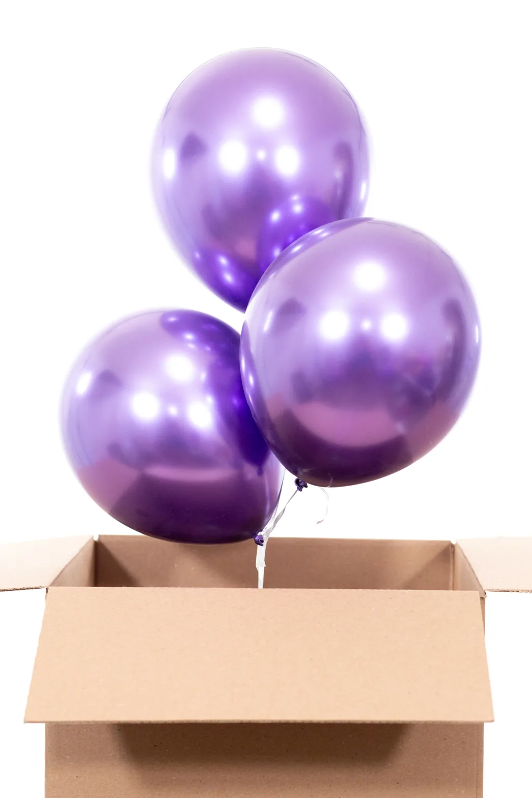 putting balloons into cardboard box to gift to friends
