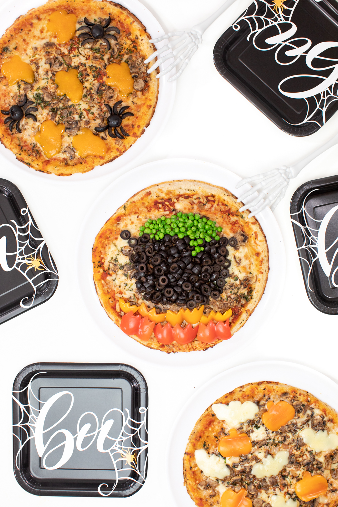 pizza party ideas to celebrate halloween. Festive witch inspired pizza and halloween paper serve-wear.