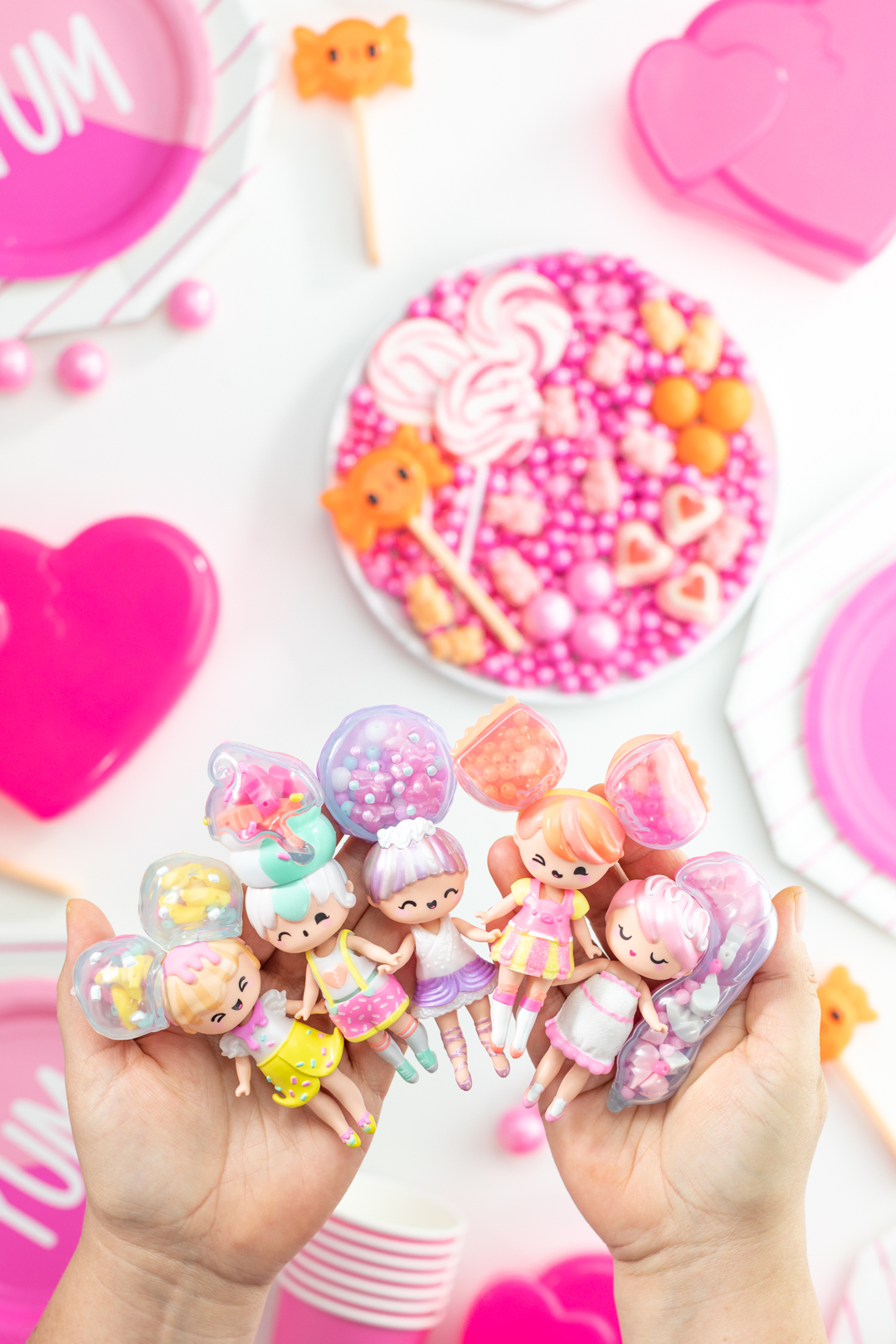 several secret crush dolls assembled being held in women's hands