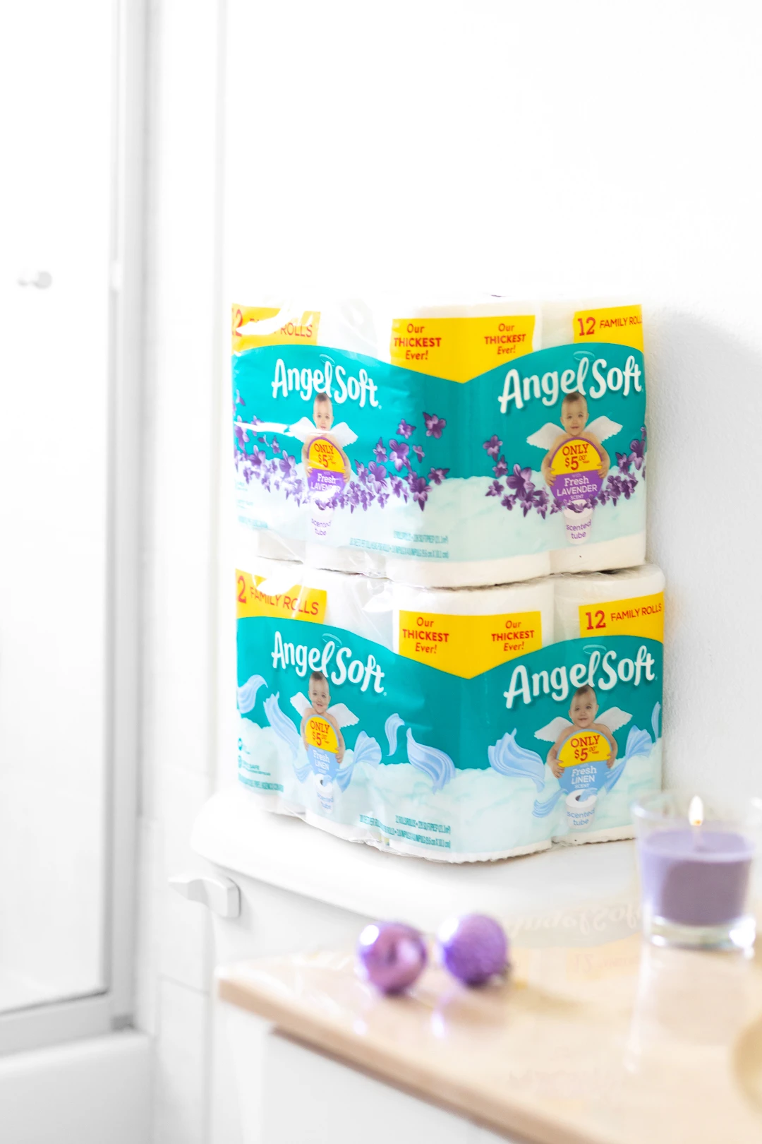 Angel Soft Scented Toilet Paper in soft bathroom setting with purple accents to make the lavender pop