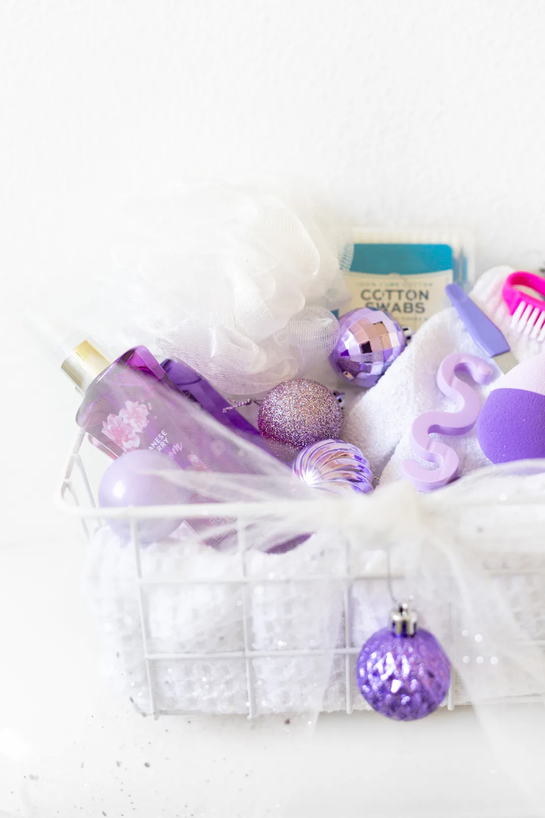 purple holiday themed toiletries basket for guest room