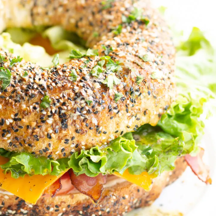 BLT bundt sandwich stuffed with BLT toppings and topped with fresh herbs