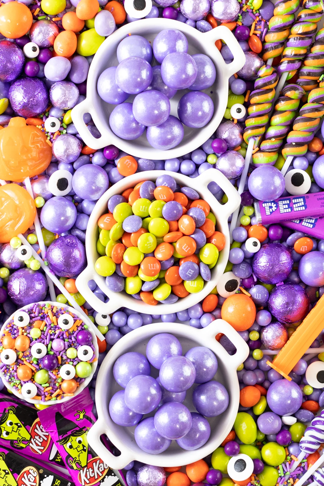 purple, orange and green halloween candy table