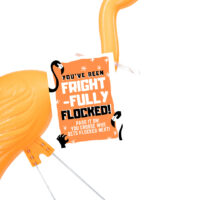 orange halloween flamingo with a you've been flocked sign
