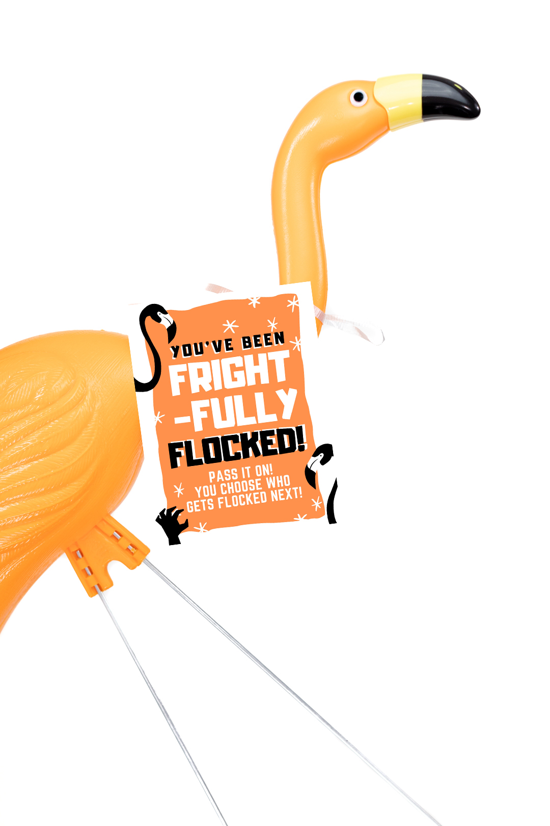 orange halloween flamingo with a you've been flocked sign