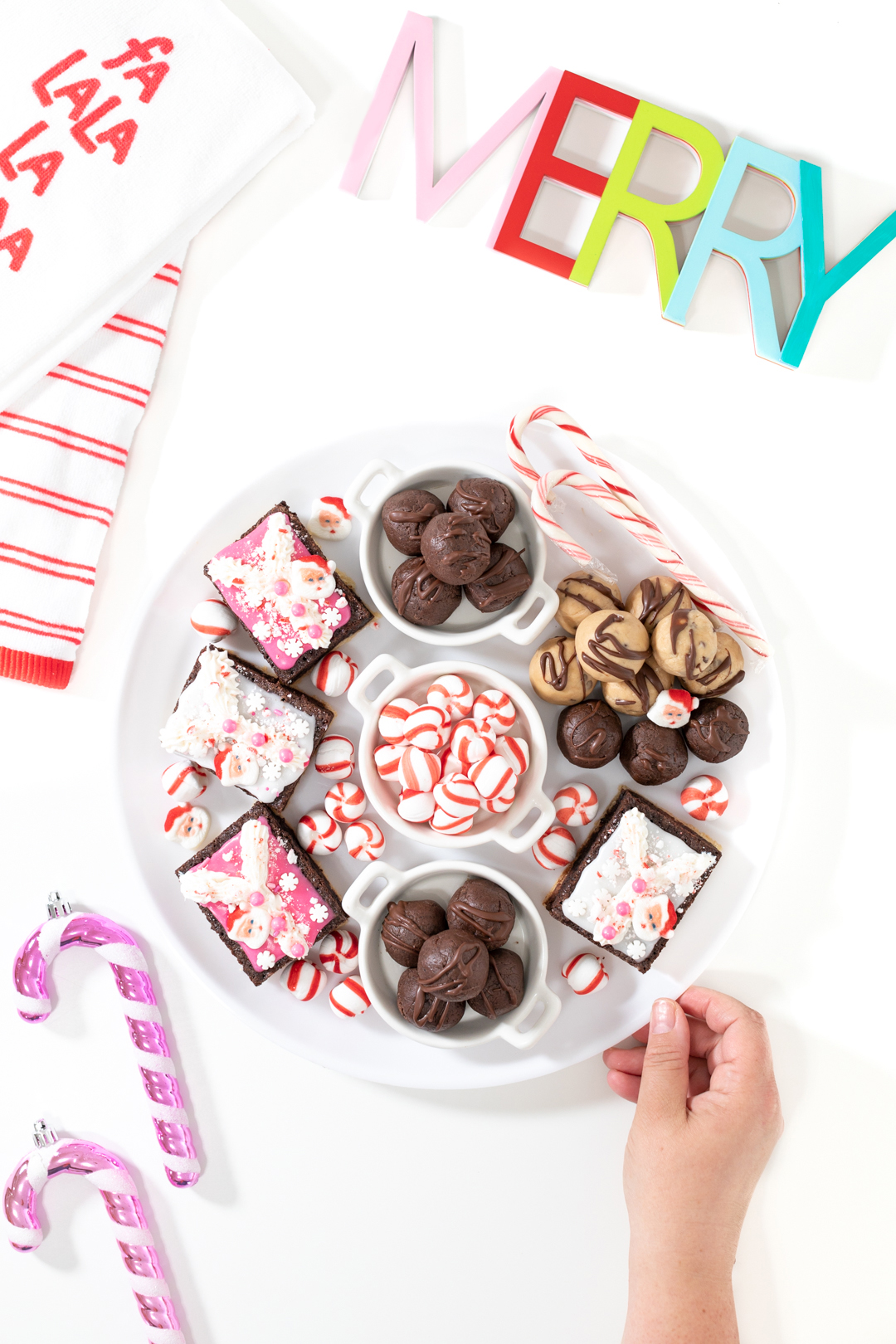 christmas dessert charcuterie board with brookies, peppermints, candy canes.