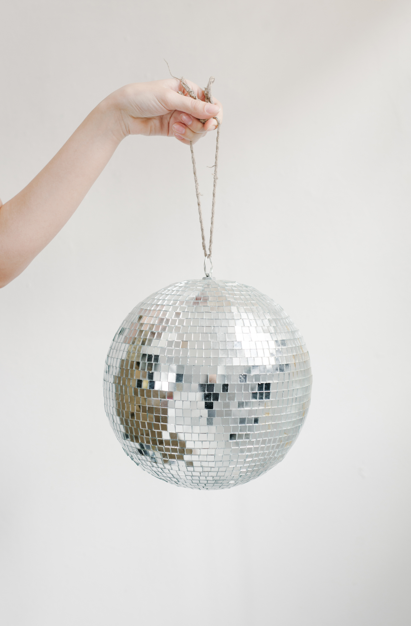 Girl holding a small disco ball