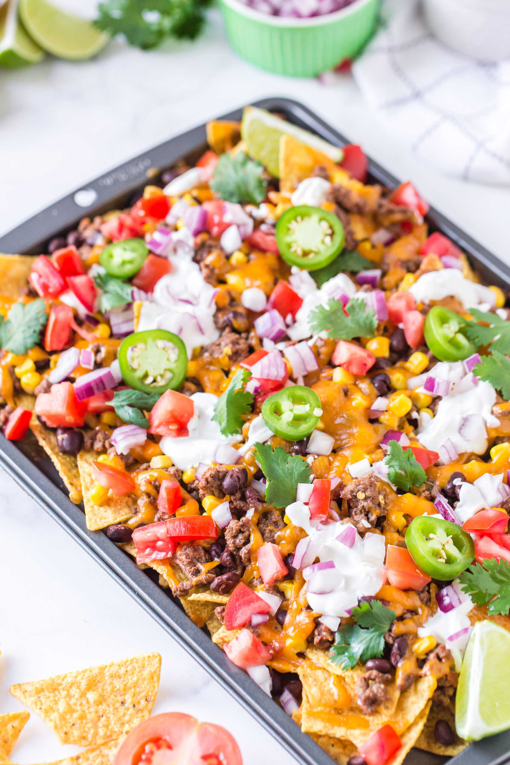 baked nachos prepared and loaded with toppings
